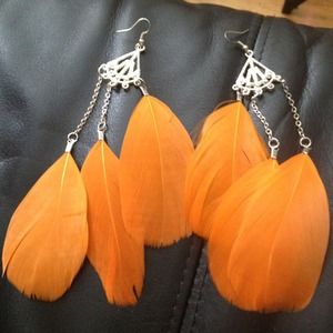 Orange feathered earrings