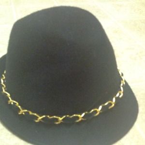 Super sexy BEBE black hat with gold detail.