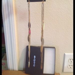Beautiful long gold BEBE earrings