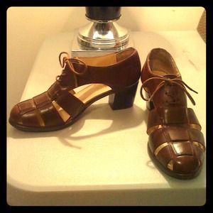 A Pair Of Brown Laced Up Vintage Heels