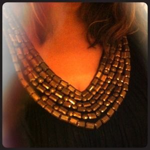 Gold beaded neckline black dress