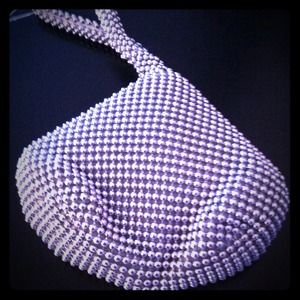 New silver waist purse. Perfect for partying.