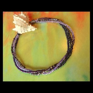 Three strand necklace in shades of purple
