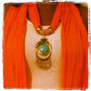 Orange scarf with pendant