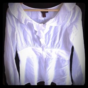 Ruffled white long sleeved blouse
