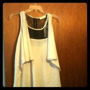 Sleeveless top. Partial lace.