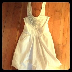 Summer white mini dress with gem neckline