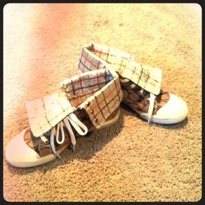 Gold high top Coach tennis shoes with Poppy inside