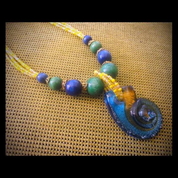 Beautiful necklace with a glass pendant