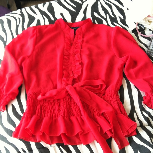Red ruffle shirt.
