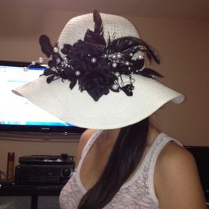 Handcrafted Straw Hat with beads and Feathers.