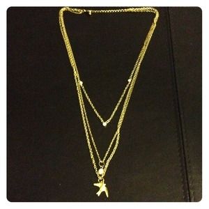 Triple layered bird necklace in gold