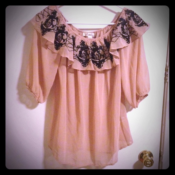 Elegant light pink top with black floral designs
