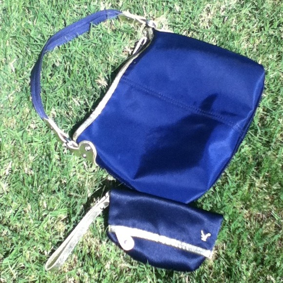 AEO navy bag with gold detailing includes wristlet - Picture 1 of 3