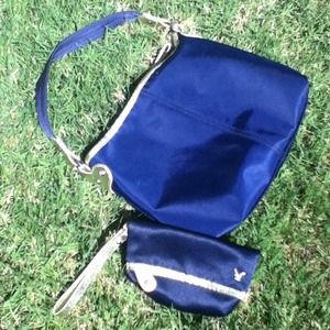 AEO navy bag with gold detailing includes wristlet