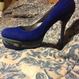 I am selling blue snakeskin and suede heels.