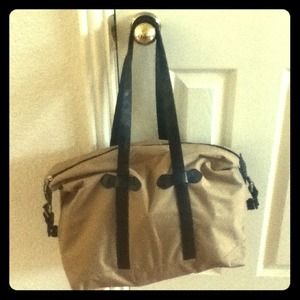 Large Tan and black duffle bag