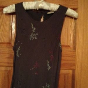 Sleeveless dress. Ankle length and form fitting.