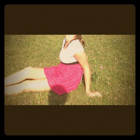 White and pink dress with black band.