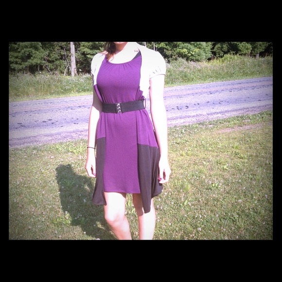 Black, grey, and purple dress with black belt.
