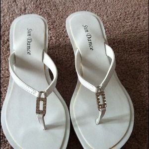 Beautiful white sandals with studs.