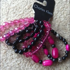 Pink and black bracelets.