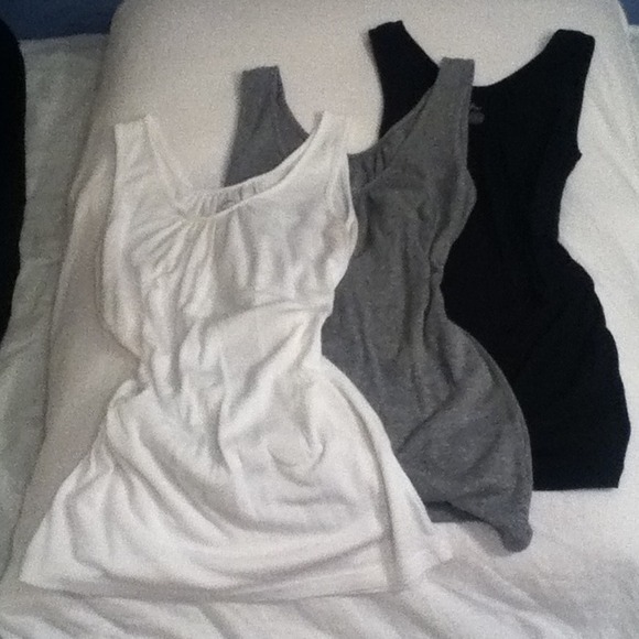 Black, grey, and white tank tops
