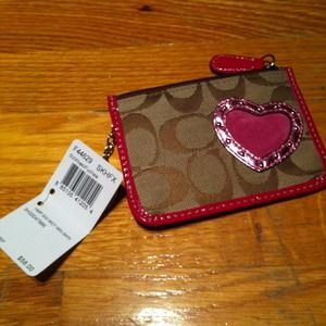 Brown mini coach heart pouch