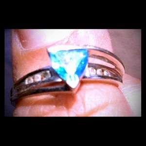 White gold, blue topaz, 6 diamonds, size 8.