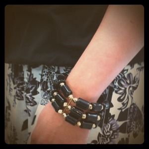 New black and gold bracelet.