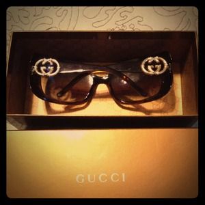 Brown and gold Gucci sunglasses.