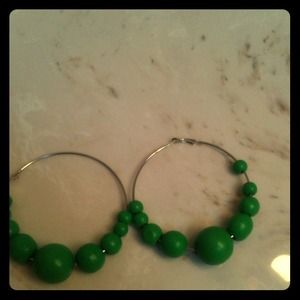 Green beaded hoop earrings