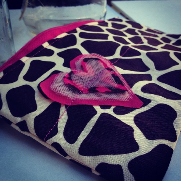 Brown and pink animal print clutch