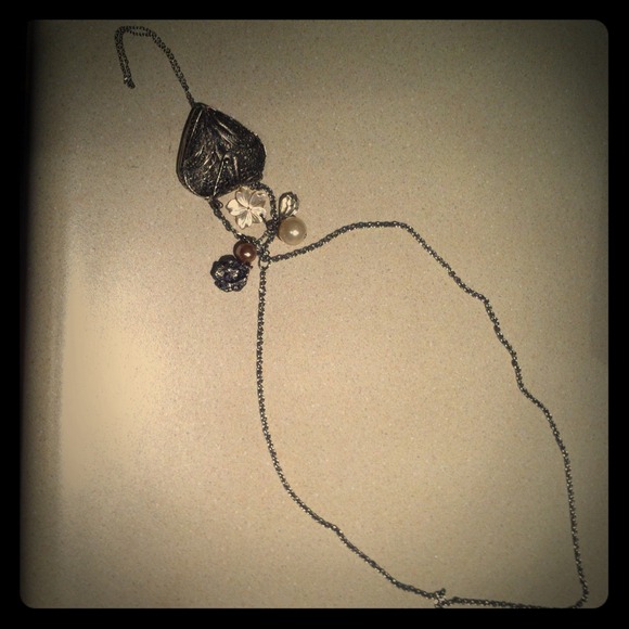 Long silver heart locket and charm necklace