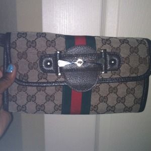 Authentic Gucci clutch w/ strap...super cute!