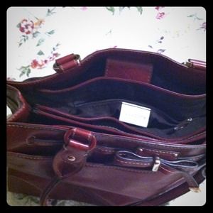 Designer purse many sections. Reserved replica.