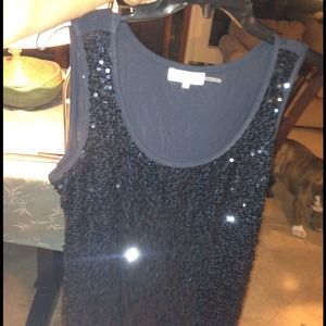 Sleeveless black sequin Calvin Klein top.