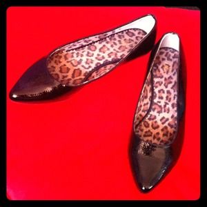 Black pointed toe flats.