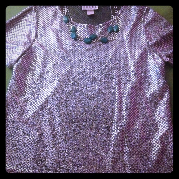 Silver sparkly shirt.