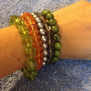 Five beaded bracelets.