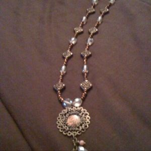 Brown and  gold necklace with a touch of peach.