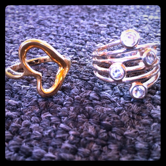 One pretty gold heart ring and a silver ring!