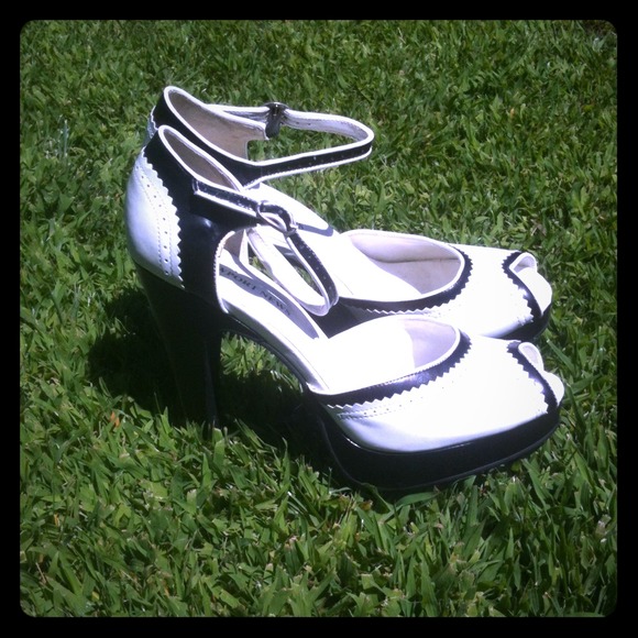 Black and white peep toe pumps