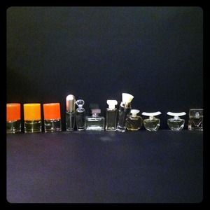 Collection of 12 baby perfume bottles