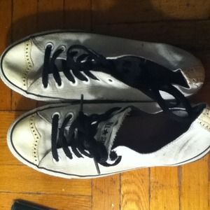 White converse, with shiny leather toes. (front)