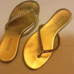 REDUCEDShiny Gold Guess flip flops.