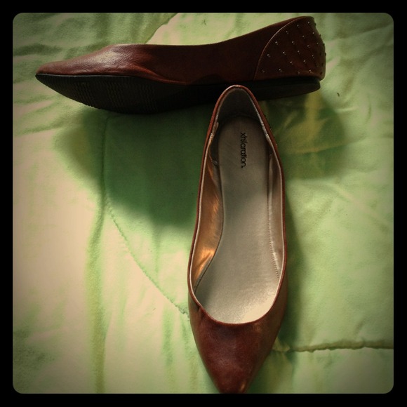 Brown studded flats.
