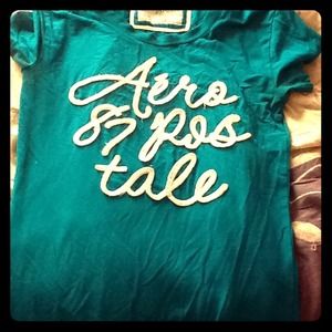 Shirt with words writtin in beads