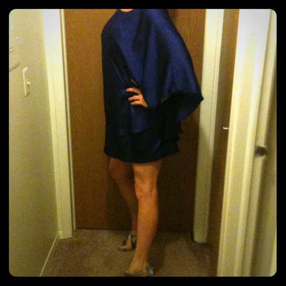 Purple one shoulder drape dress.
