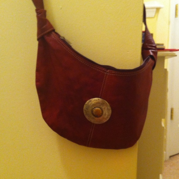 Vintage leather messenger bag with silver emblem